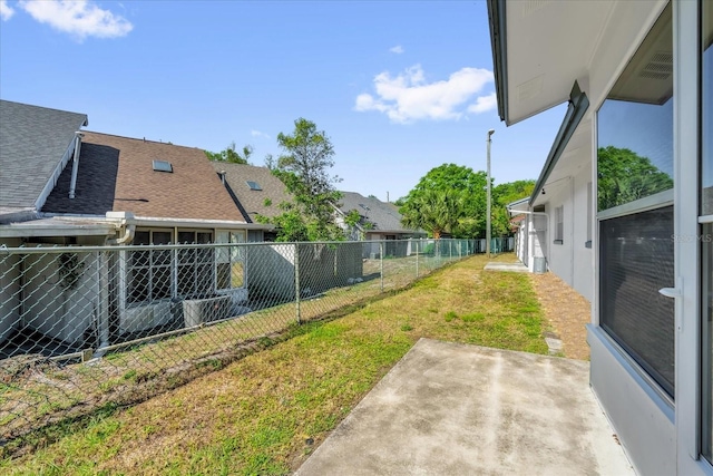 view of yard featuring a patio area and a fenced backyard