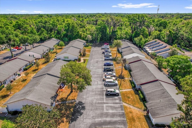 birds eye view of property with a residential view and a wooded view