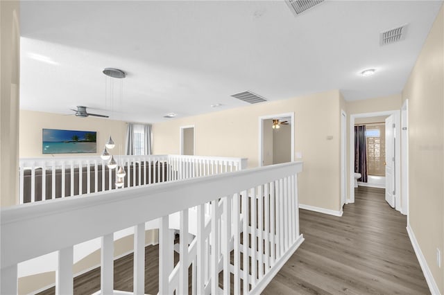 1114 Landale Ct, Orlando, FL 32828 - corridor with wood finished floors and an upstairs landing