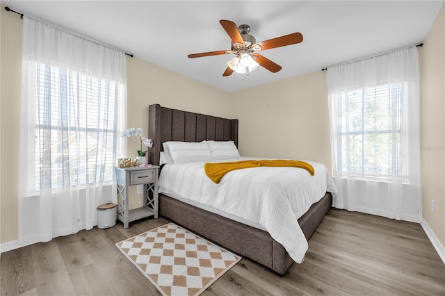 1114 Landale Ct, Orlando, FL 32828 - bedroom featuring wood finished floors and a ceiling fan