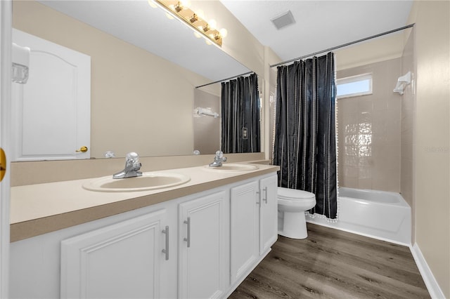 1114 Landale Ct, Orlando, FL 32828 - bathroom with double vanity, shower / bath combination with curtain, and wood finished floors