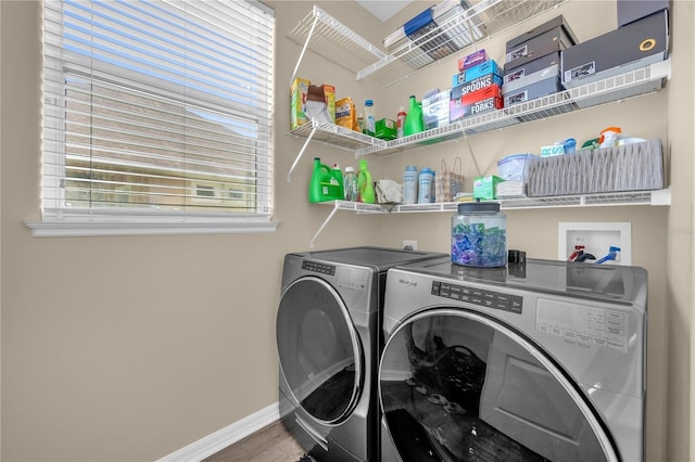 1114 Landale Ct, Orlando, FL 32828 - laundry area featuring washing machine and dryer and wood finished floors