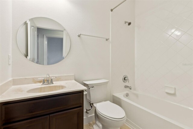 full bathroom featuring bathing tub / shower combination, vanity, and toilet