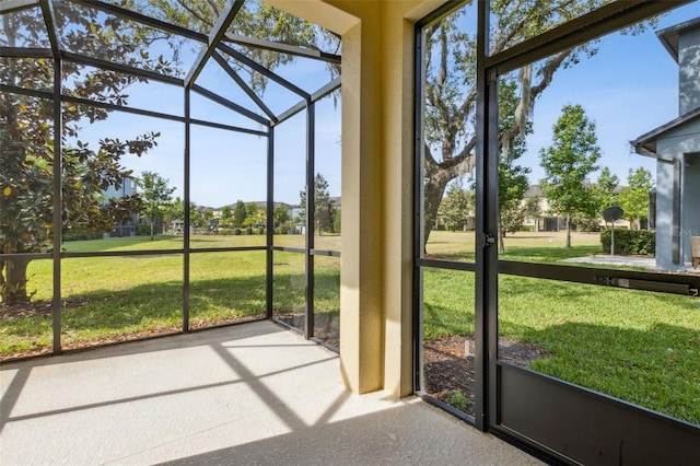 unfurnished sunroom featuring a wealth of natural light