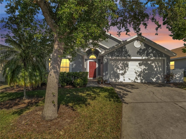 166 Laurel Ridge Pass, Davenport, FL 33897 - view of front of house with concrete driveway and a garage