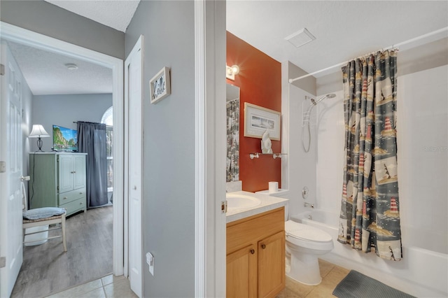 166 Laurel Ridge Pass, Davenport, FL 33897 - full bath with shower / bath combination with curtain, toilet, tile patterned flooring, and vanity