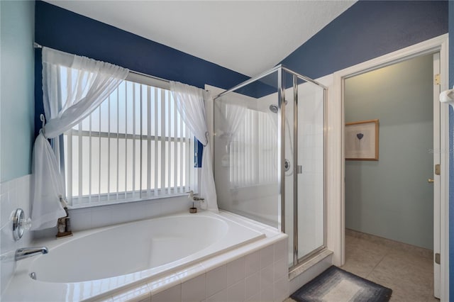 166 Laurel Ridge Pass, Davenport, FL 33897 - bathroom with a stall shower, a garden tub, and tile patterned flooring
