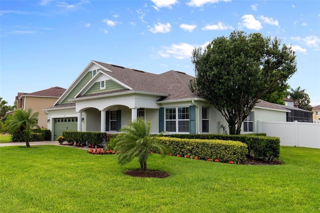 690 Cascading Creek Ln, Winter Garden, FL 34787 - view of front of house featuring fence, a front yard, stucco siding, a shingled roof, and an attached garage