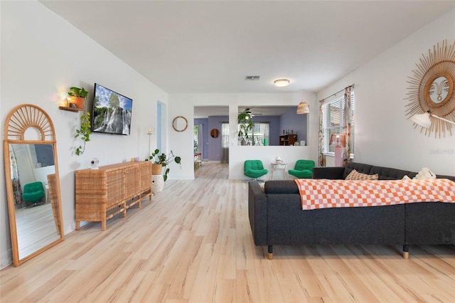 690 Cascading Creek Ln, Winter Garden, FL 34787 - living room with visible vents and light wood finished floors