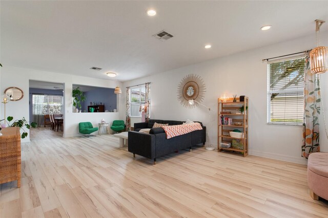 690 Cascading Creek Ln, Winter Garden, FL 34787 - living area with recessed lighting, visible vents, plenty of natural light, and light wood-style floors