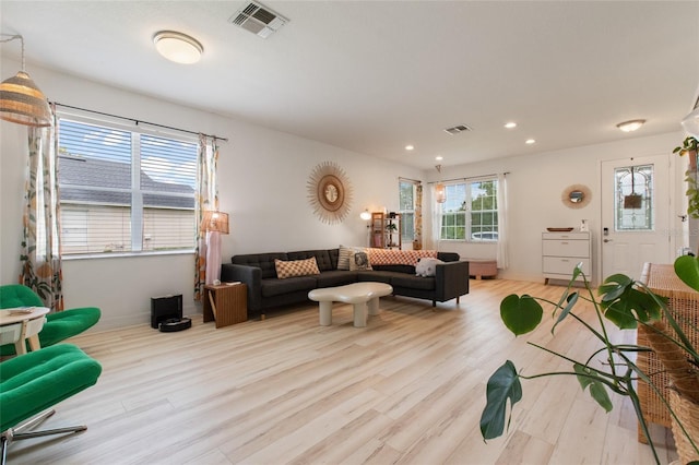 690 Cascading Creek Ln, Winter Garden, FL 34787 - living room with recessed lighting, baseboards, visible vents, and wood finished floors