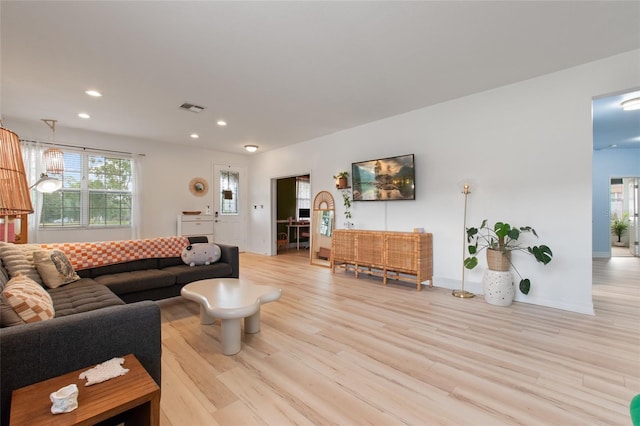 690 Cascading Creek Ln, Winter Garden, FL 34787 - living room featuring baseboards, recessed lighting, light wood-style flooring, and visible vents