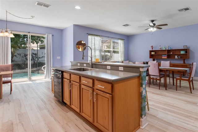 690 Cascading Creek Ln, Winter Garden, FL 34787 - kitchen with visible vents, plenty of natural light, and a sink