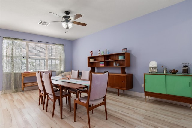 690 Cascading Creek Ln, Winter Garden, FL 34787 - dining space with light wood-style floors, ceiling fan, and visible vents