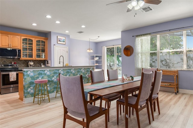 690 Cascading Creek Ln, Winter Garden, FL 34787 - dining room featuring recessed lighting, ceiling fan, visible vents, and light wood-type flooring