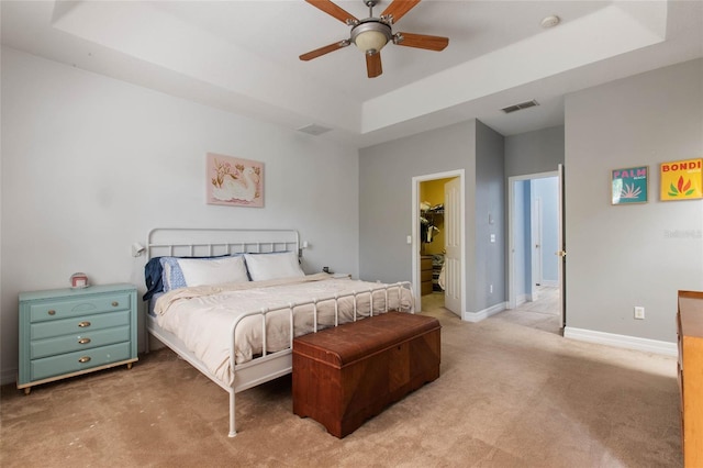 690 Cascading Creek Ln, Winter Garden, FL 34787 - bedroom featuring visible vents, baseboards, ceiling fan, light colored carpet, and a tray ceiling