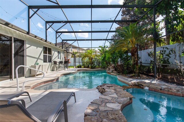 690 Cascading Creek Ln, Winter Garden, FL 34787 - view of swimming pool featuring a lanai, fence, a patio, and a fenced in pool