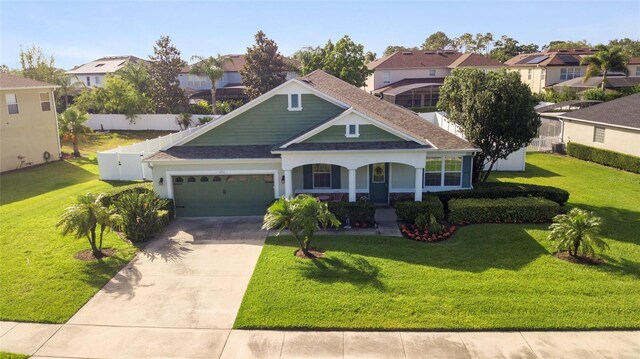 690 Cascading Creek Ln, Winter Garden, FL 34787 - view of front of property with a residential view, fence, an attached garage, a front yard, and concrete driveway
