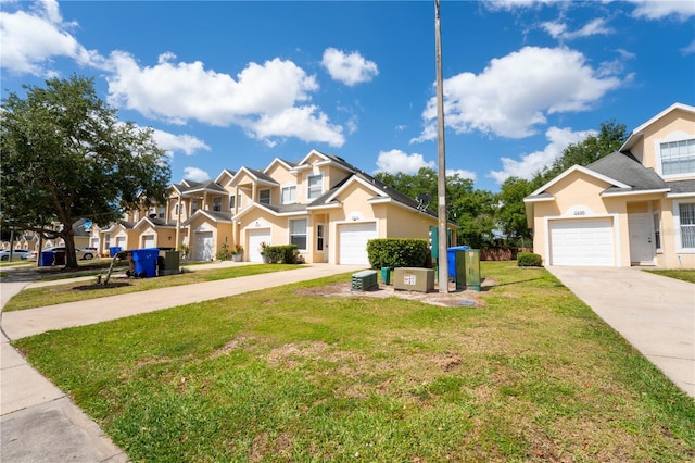 2434 Temple Grove Ln, Kissimmee, FL 34741 - traditional home with a residential view, a front lawn, concrete driveway, a garage, and stucco siding