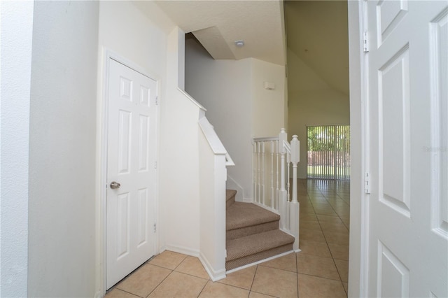 2434 Temple Grove Ln, Kissimmee, FL 34741 - staircase featuring baseboards and tile patterned flooring