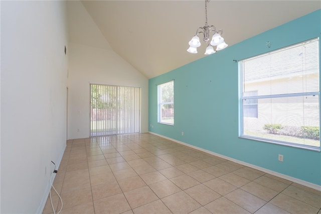 2434 Temple Grove Ln, Kissimmee, FL 34741 - empty room with baseboards, an inviting chandelier, light tile patterned floors, and high vaulted ceiling