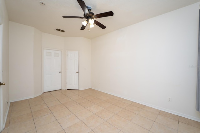 2434 Temple Grove Ln, Kissimmee, FL 34741 - unfurnished room with baseboards, a ceiling fan, visible vents, and light tile patterned floors