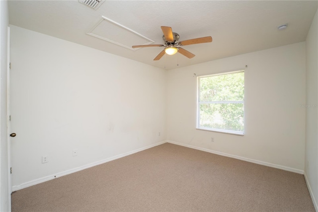 2434 Temple Grove Ln, Kissimmee, FL 34741 - carpeted spare room featuring attic access, baseboards, a ceiling fan, and visible vents