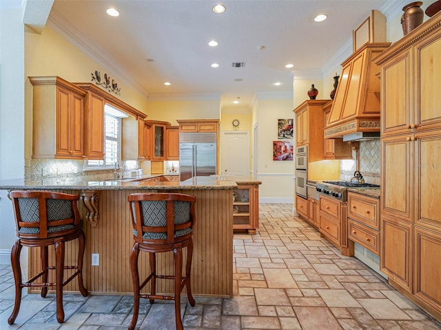 2266 12th St, Vero Beach, FL 32960 - kitchen featuring recessed lighting, visible vents, stainless steel appliances, and a peninsula