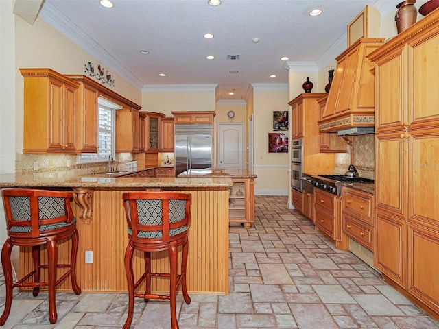 2266 12th St, Vero Beach, FL 32960 - kitchen with light stone countertops, a peninsula, recessed lighting, and appliances with stainless steel finishes