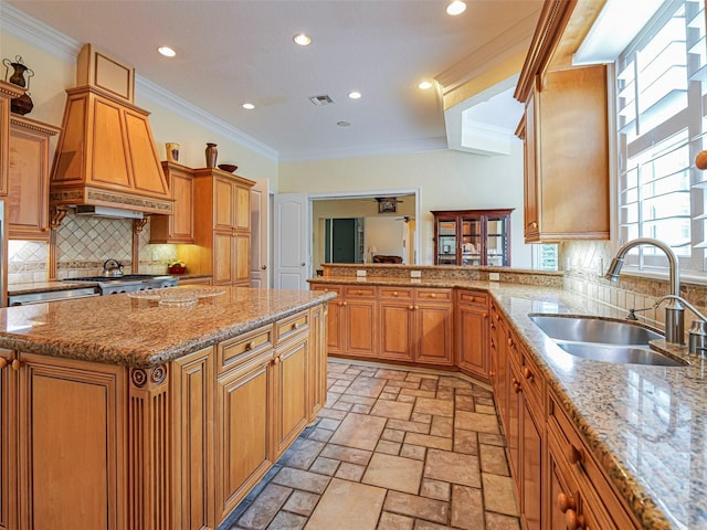 2266 12th St, Vero Beach, FL 32960 - kitchen with plenty of natural light, a sink, backsplash, and light stone counters