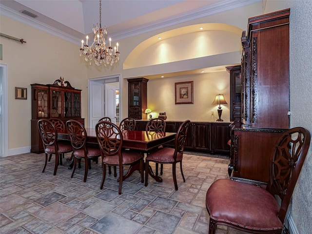2266 12th St, Vero Beach, FL 32960 - dining area featuring a chandelier, stone finish floor, visible vents, and a towering ceiling