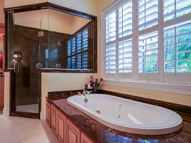 2266 12th St, Vero Beach, FL 32960 - full bath featuring a tub with jets, tile patterned flooring, and a stall shower