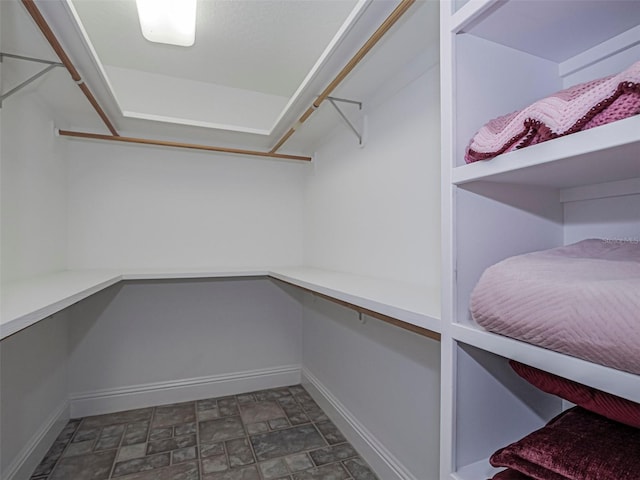 2266 12th St, Vero Beach, FL 32960 - walk in closet featuring stone finish flooring