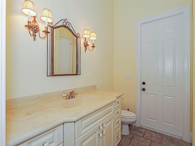 2266 12th St, Vero Beach, FL 32960 - half bath with vanity, stone finish flooring, and toilet