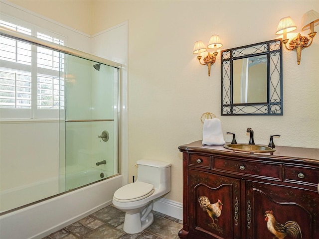 2266 12th St, Vero Beach, FL 32960 - bathroom with baseboards, combined bath / shower with glass door, toilet, and vanity