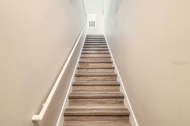 14238 Fredricksburg Dr Unit 310, Orlando, FL 32837 - staircase featuring visible vents and wood finished floors