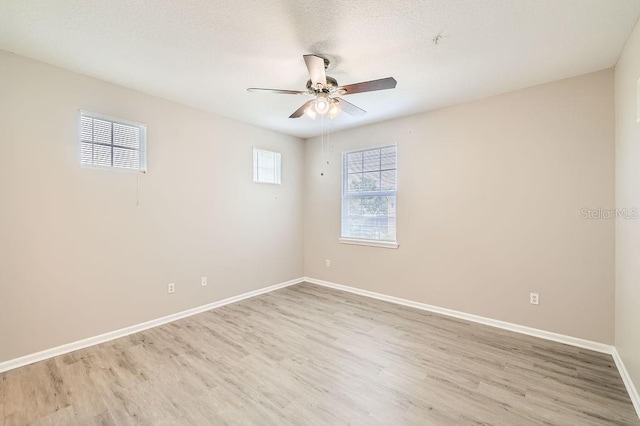 14238 Fredricksburg Dr Unit 310, Orlando, FL 32837 - spare room with visible vents, ceiling fan, baseboards, and light wood-style floors