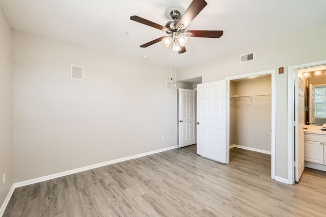 14238 Fredricksburg Dr Unit 310, Orlando, FL 32837 - unfurnished bedroom with baseboards, visible vents, and light wood-style floors
