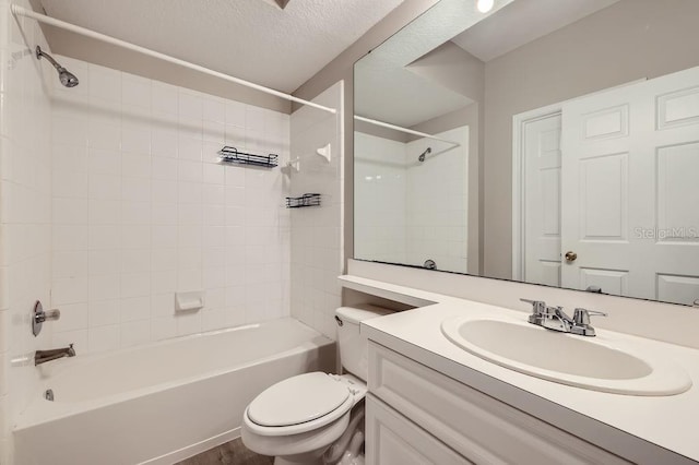 14238 Fredricksburg Dr Unit 310, Orlando, FL 32837 - full bathroom featuring toilet, a textured ceiling, bathing tub / shower combination, and vanity