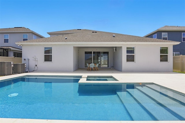 4779 Cragmere Loop, Clermont, FL 34711 - view of pool featuring a patio, fence, and a pool with connected hot tub
