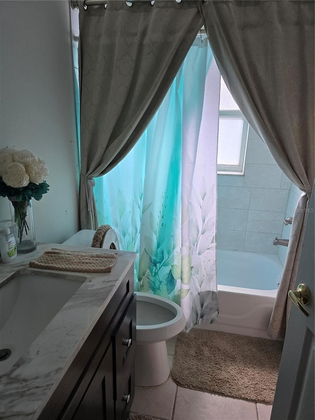 1639 Nestlewood Trl, Orlando, FL 32837 - bathroom featuring toilet, vanity, shower / bath combination with curtain, and tile patterned floors