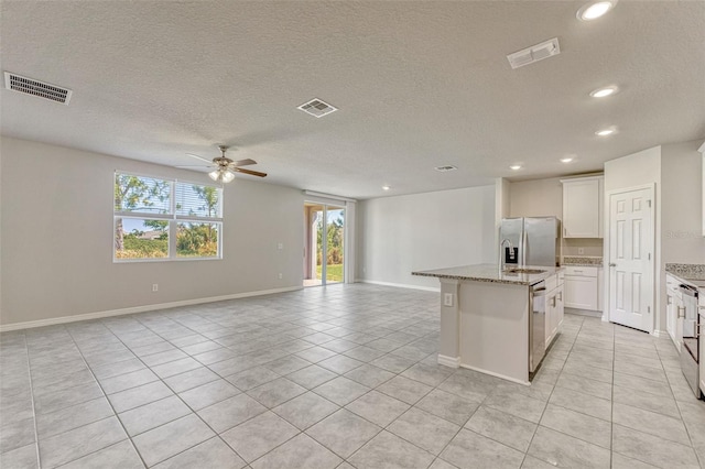 439 Sarah Nicole Way, New Smyrna Beach, FL 32168 - kitchen featuring light tile patterned floors, visible vents, and appliances with stainless steel finishes
