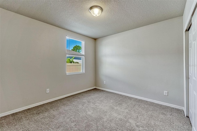 439 Sarah Nicole Way, New Smyrna Beach, FL 32168 - carpeted empty room featuring baseboards and a textured ceiling
