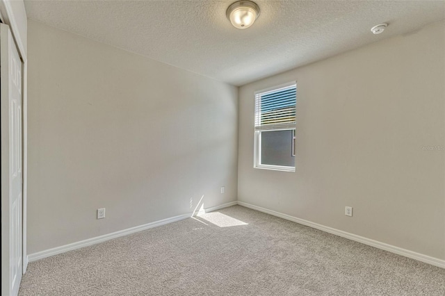 439 Sarah Nicole Way, New Smyrna Beach, FL 32168 - carpeted empty room featuring a textured ceiling and baseboards