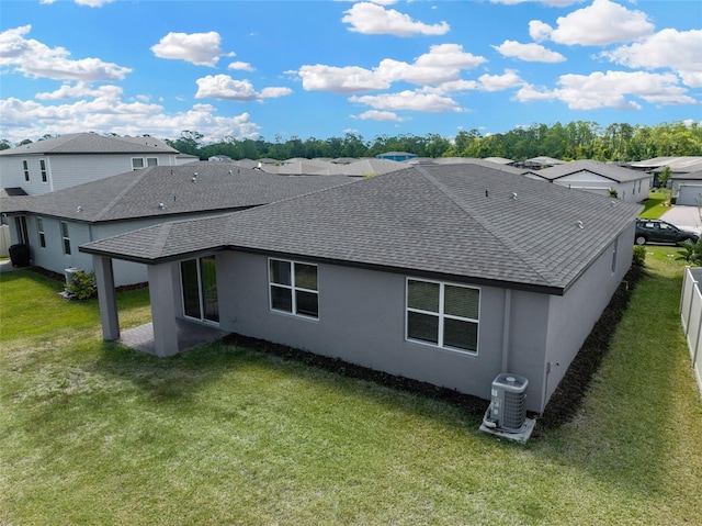 439 Sarah Nicole Way, New Smyrna Beach, FL 32168 - rear view of property featuring a residential view, central air condition unit, a shingled roof, and stucco siding