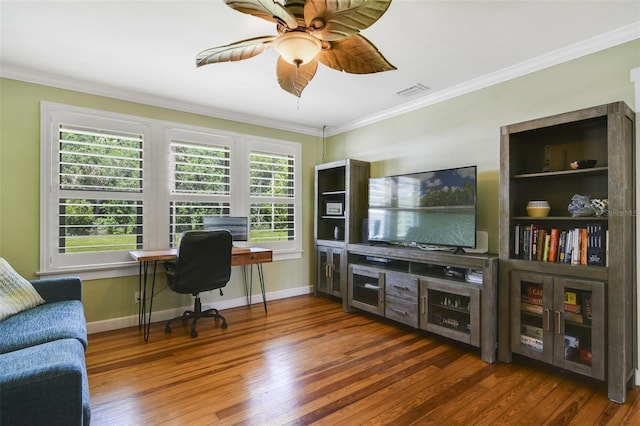 office space featuring crown molding, wood finished floors, ceiling fan, and a healthy amount of sunlight