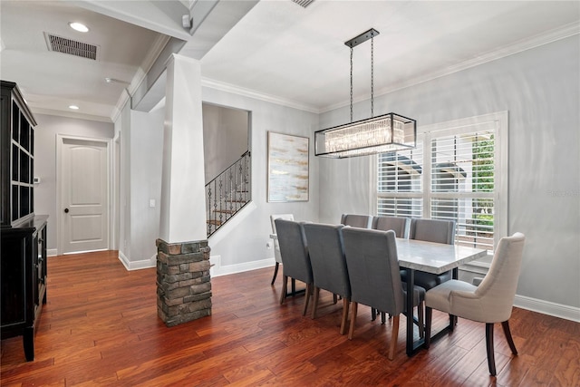 dining room with dark wood finished floors, visible vents, baseboards, and stairs