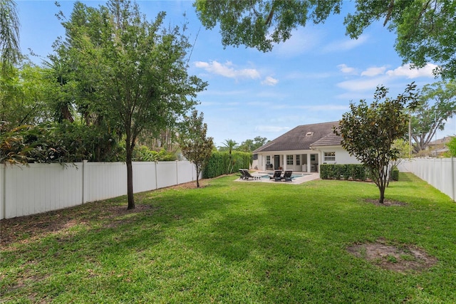 view of yard with a patio area and a fenced backyard