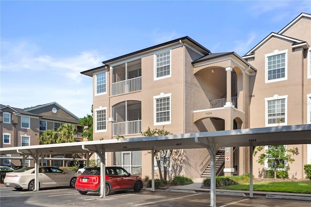view of building exterior with covered parking