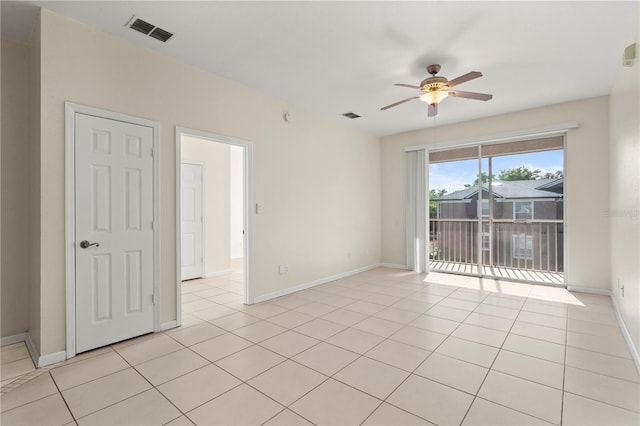 unfurnished room with baseboards, visible vents, ceiling fan, and light tile patterned flooring